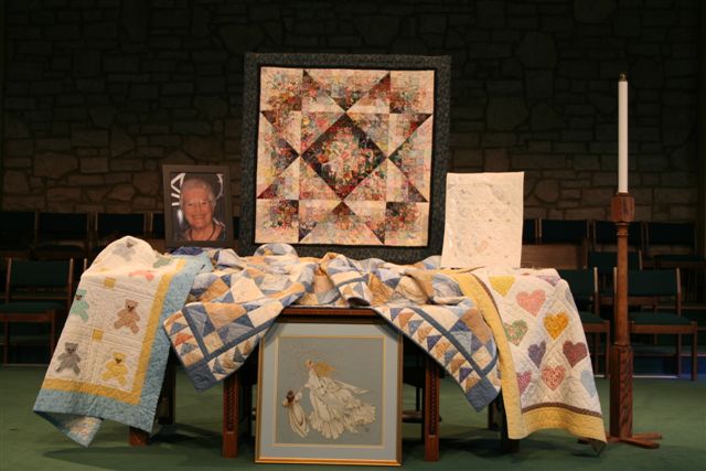 Quilts and needlework by Peggy Straughen.